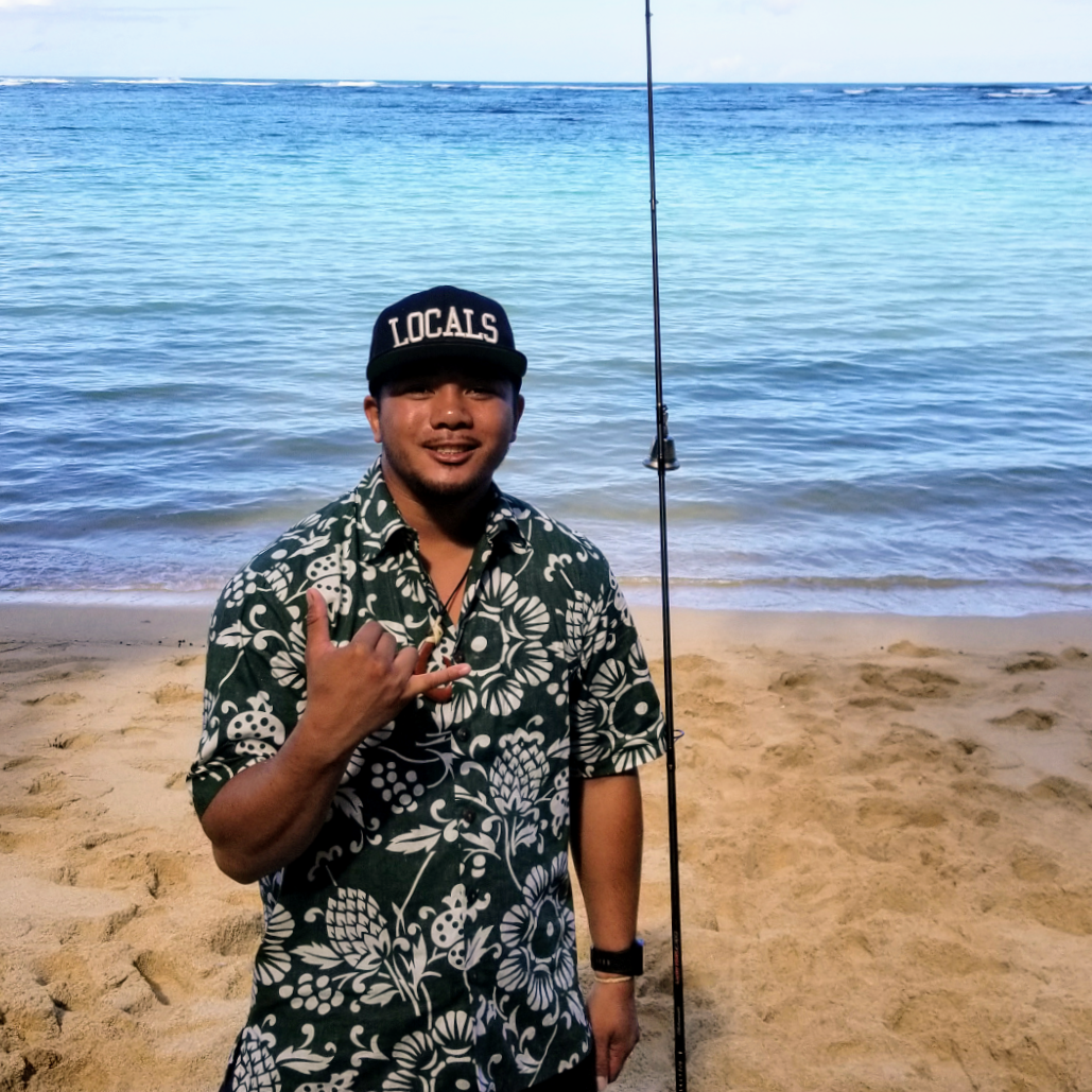 a person standing on a beach near a body of water